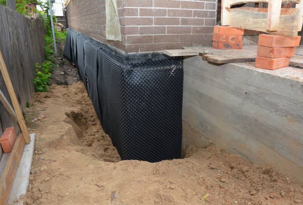 SJ Waterproofing Pros technician performing targeted Basement Waterproofing assessment in Leesburg, GA